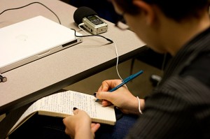 Student taking notes